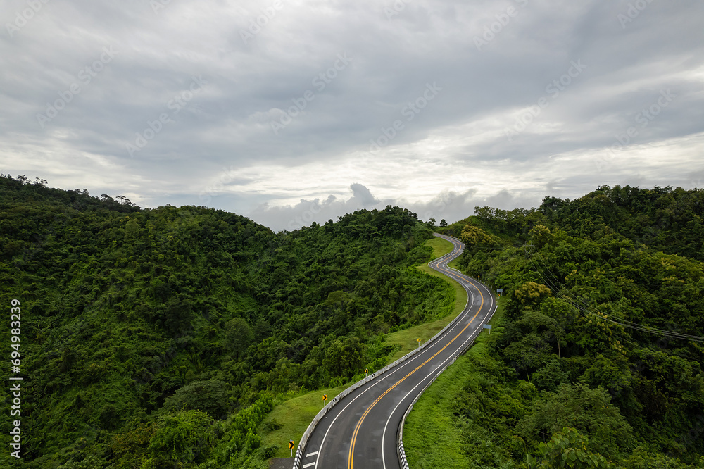 Road on mountain which a lot of road curve very popular landmark for tourist in Nan province, Thailand.