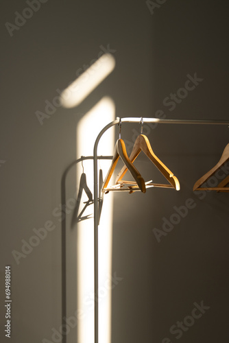 Empty hangers with rays of light from the sunset