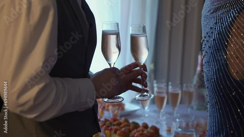 Wallpaper Mural The waiter or waitress holds a tray with glasses of champagne. White sparkling wine at the celebration. Welcome drink. Wedding celebration party. Alcoholic beverage. Torontodigital.ca