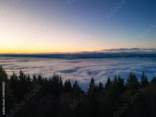 Clouds covering Canadian Mountain Landscape. Aerial Background