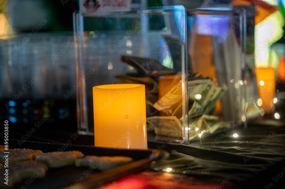 candle beside donation box candle beside donation box