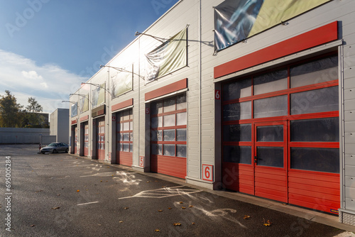 Building with a commercial vehicle repair shop with six garage doors. photo