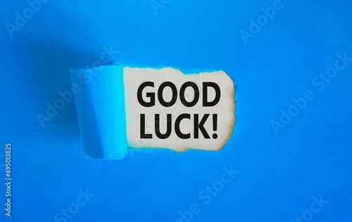 Good luck symbol. Concept words Good luck on beautiful white paper. Beautiful blue table blue background. Business, motivational good luck concept. Copy space.