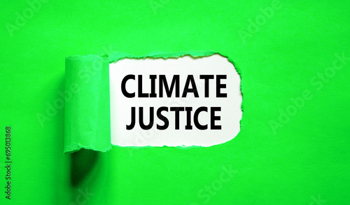 Climate justice symbol. Concept words Climate justice on beautiful white paper. Beautiful green paper background. Business environment climate justice concept. Copy space.