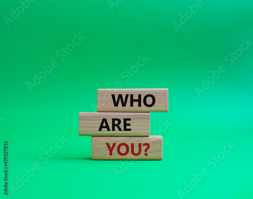Who are You symbol. Concept words Who are You on wooden blocks. Beautiful green background. Business and Who are You concept. Copy space.