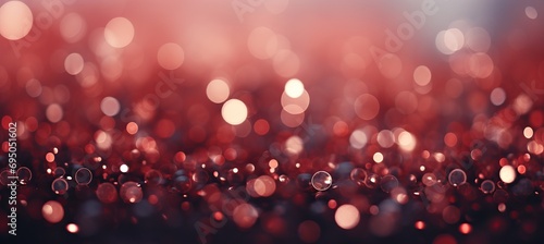 Red glitter bokeh lights on defocused christmas background for holiday and new year celebration