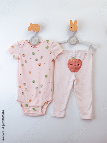 set of different clothes for baby on white background