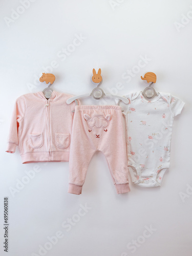 set of different clothes for baby on white background