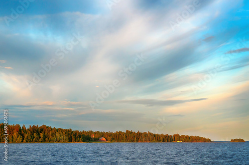 View of Konevets Island, Konevsky Skete at sunset from Lake Ladoga photo
