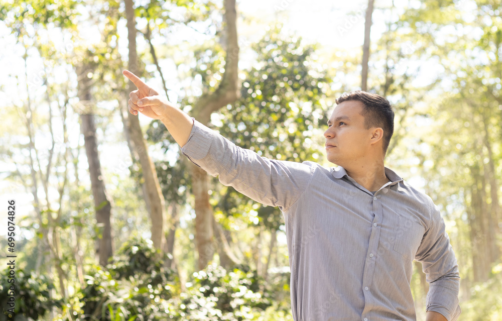 man pointing in nature man pointing in nature