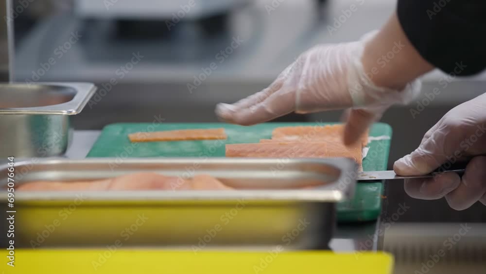 Cutting Salmon Fish To Use As Ingredient For Asian Cuisine Dish. Cutting Salmon Fish With Kitchen Knife. Cutting Salmon Fish In Slices. Preparing Ingredients For Sushi. Fillet. Meal. Food Cooking Cutting Salmon Fish To Use As Ingredient For Asian Cuisine Dish. Cutting Salmon Fish With Kitchen Knife. Cutting Salmon Fish In Slices. Preparing Ingredients For Sushi. Fillet. Meal. Food Cooking