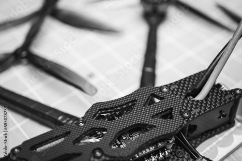 Frame, FPV racing drone frame, assembly, soldering, for the armed forces of Ukraine, installed with tools on the desktop, close-up view