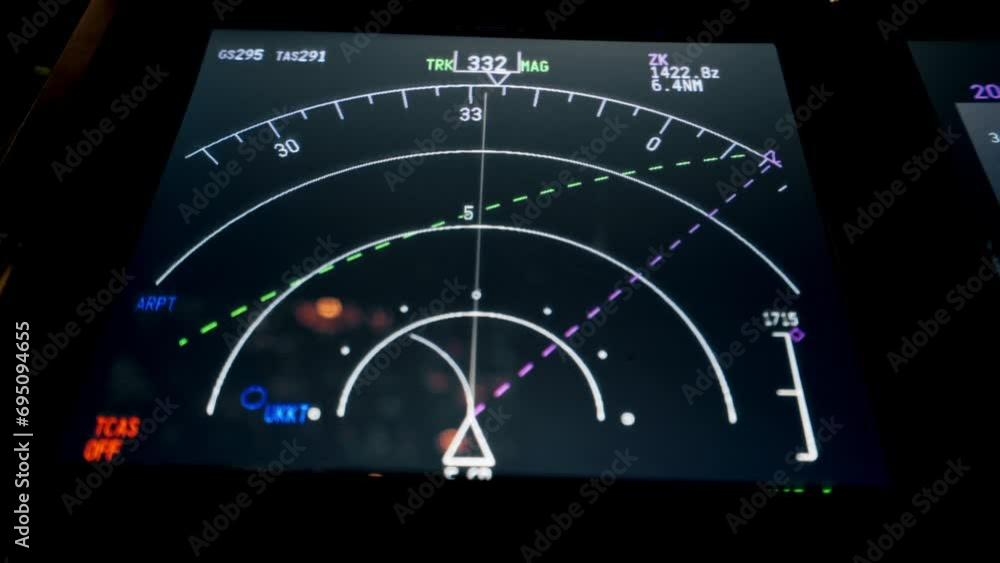 close-up of radar control and navigation panel in cockpit of airplane ...