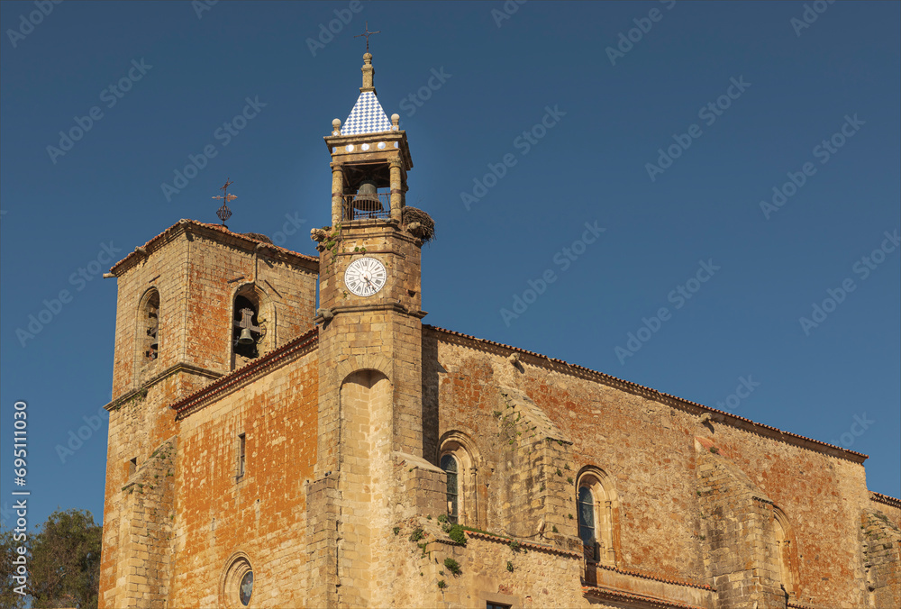 Tall historic bell tower of an ancient church