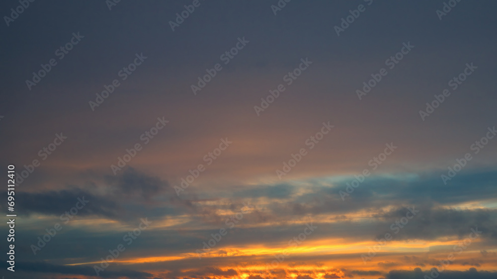 Beautiful sky background - Sunset Sunrise sky with light clouds and real sun.