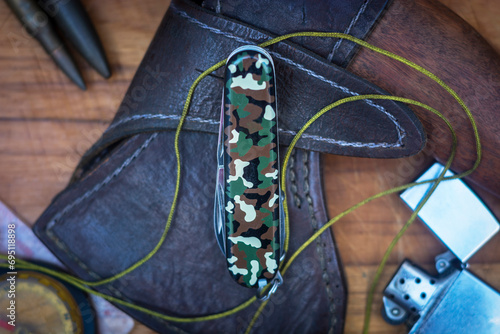 Camouflage pocket knife with military props