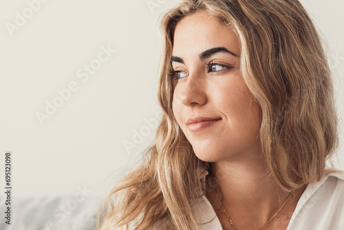 Happy young woman look in distance feeling positive and optimistic, dream or visualizing of new beginning, smiling millennial girl thinking overjoyed excited for future, happiness, good mood concept.