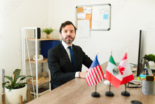 Latin diplomat working on the TMEC at his office photo