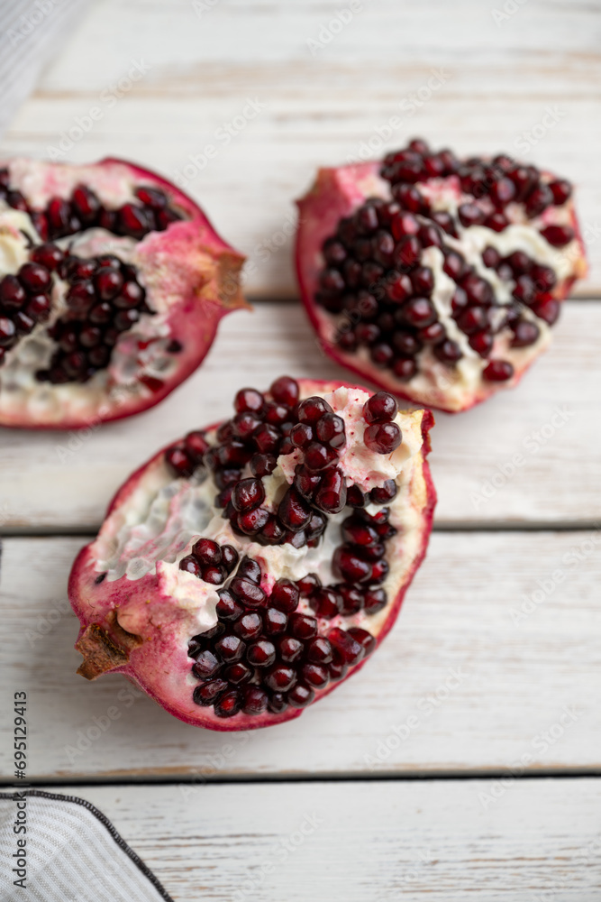 Fresh Opened Pomegranate on Light Colored Plate Fresh Opened Pomegranate on Light Colored Plate