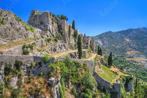 Summer mediterranean landscape - view of the Klis Fortress, which is located near Split on the Adriatic coast of Croatia