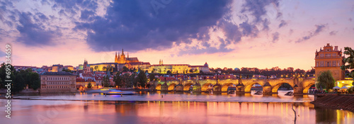 City summer landscape at sunset, panorama, banner - view of the Charles Bridge and castle complex Prague Castle in the historical center of Prague, Czech Republic photo