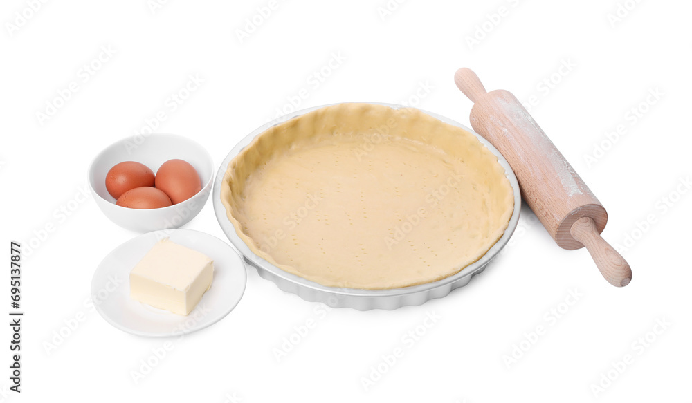 Quiche pan with fresh dough, rolling pin and ingredients isolated on white Quiche pan with fresh dough, rolling pin and ingredients isolated on white