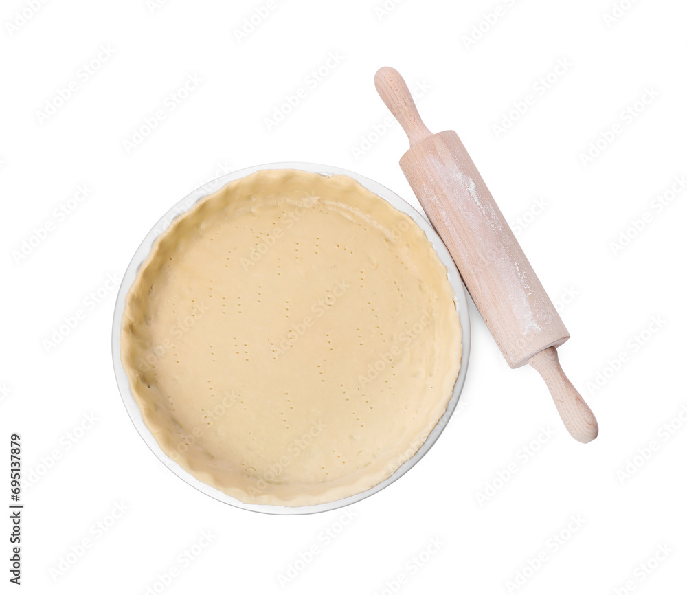 Quiche pan with fresh dough and rolling pin isolated on white, top view Quiche pan with fresh dough and rolling pin isolated on white, top view