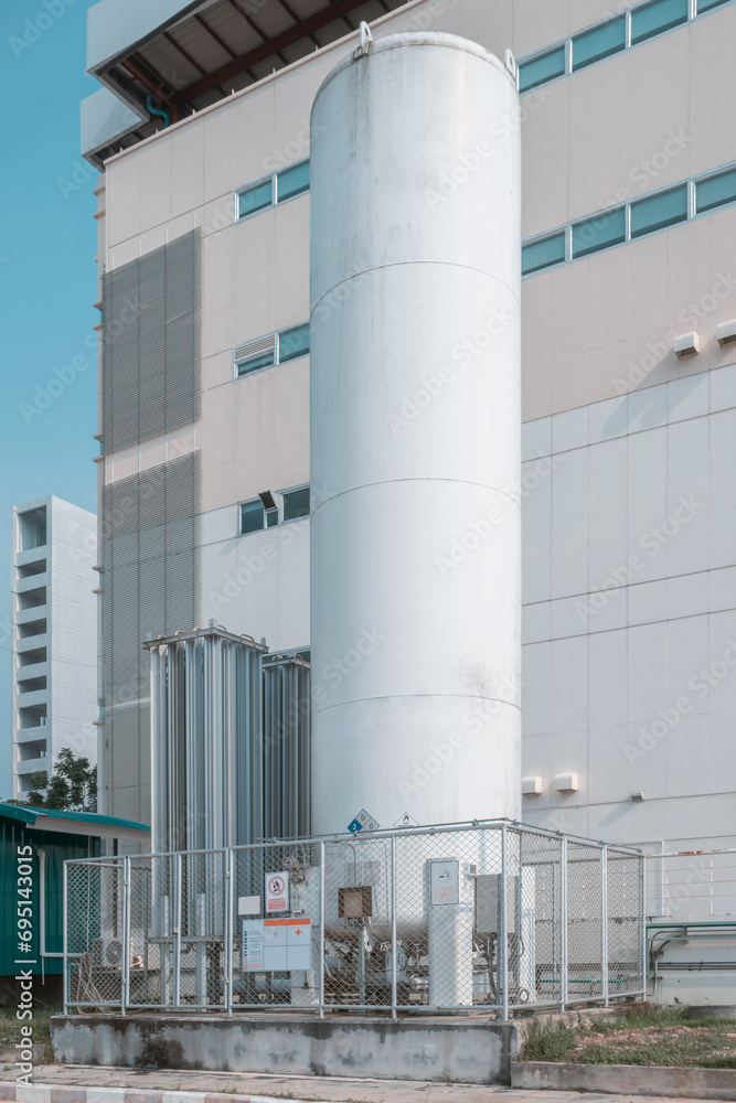 Liquid Oxygen tank in hospital for medical use. Liquid oxygen tank with warning label for flammable. Liquid Oxygen tank in hospital for medical use. Liquid oxygen tank with warning label for flammable.