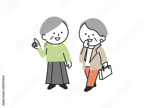 会話をしながら歩いているシニア女性の2人組