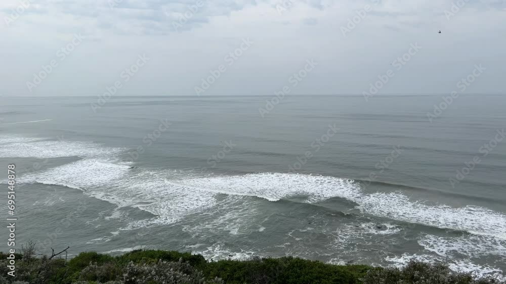 Ocean views with rolling sea waves on an overcast day Ocean views with rolling sea waves on an overcast day