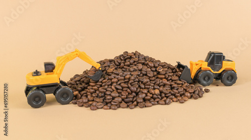 A yellow bulldozer and a yellow excavator are harvesting coffee.