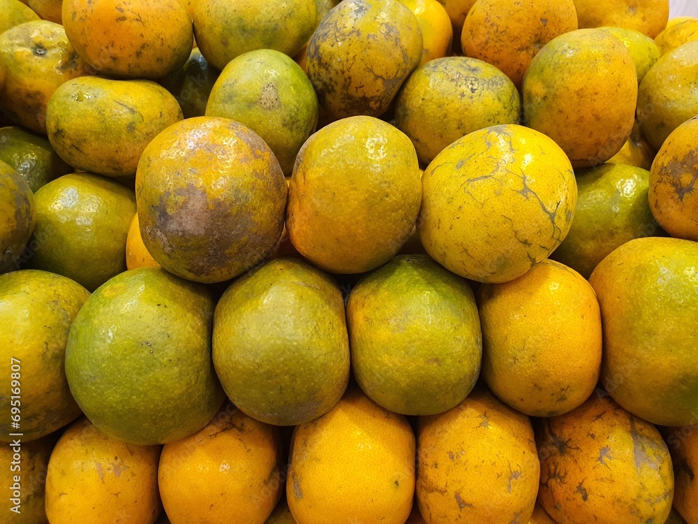 Close up pile of tasty fresh oranges sold at the market as a background. Close up pile of tasty fresh oranges sold at the market as a background.