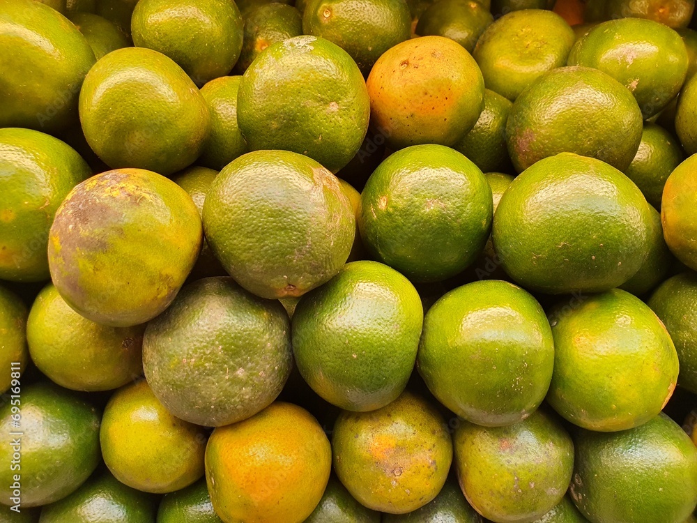 Close up pile of tasty fresh oranges sold at the market as a background. Close up pile of tasty fresh oranges sold at the market as a background.