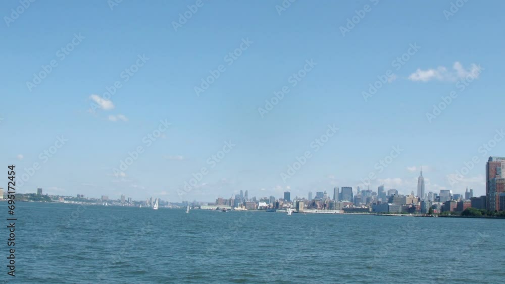 Revealing the Manhattan skyline seen from the East River on boat Revealing the Manhattan skyline seen from the East River on boat