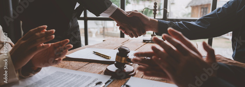 Lawyer shaking hands with businessman, investor in financial agreement, partner congratulating success or lawyer discussing contract agreement. Handshake concept. Agreement.