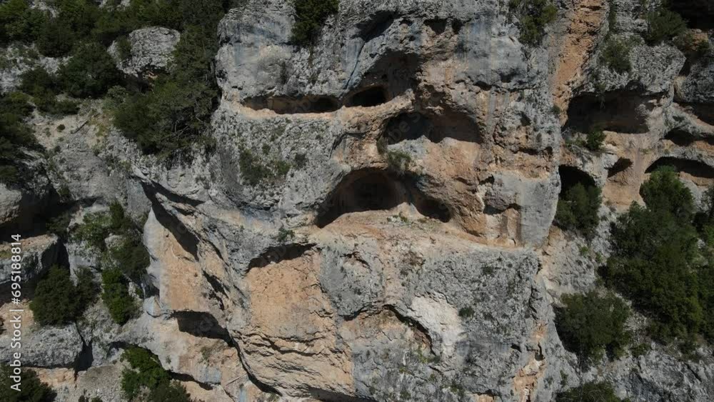 Drone view of the rocks on the mountain eroded and turned into caves, image of rocks Drone view of the rocks on the mountain eroded and turned into caves, image of rocks
