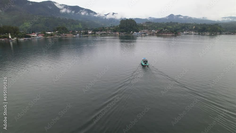 beautiful view of boats on the lake heading to the dock. beautiful view of boats on the lake heading to the dock.