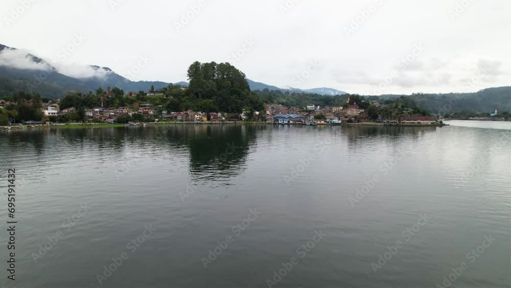 Aerial view approaching from the lake to Samosir Island Aerial view approaching from the lake to Samosir Island