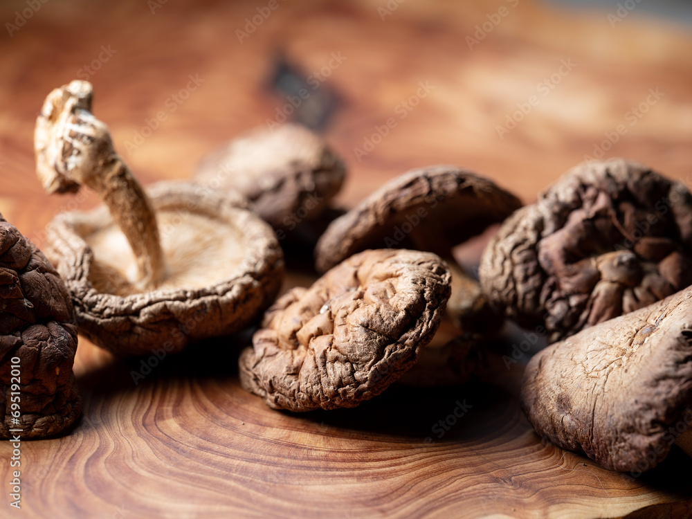 dried mushrooms on a wooden background dried mushrooms on a wooden background