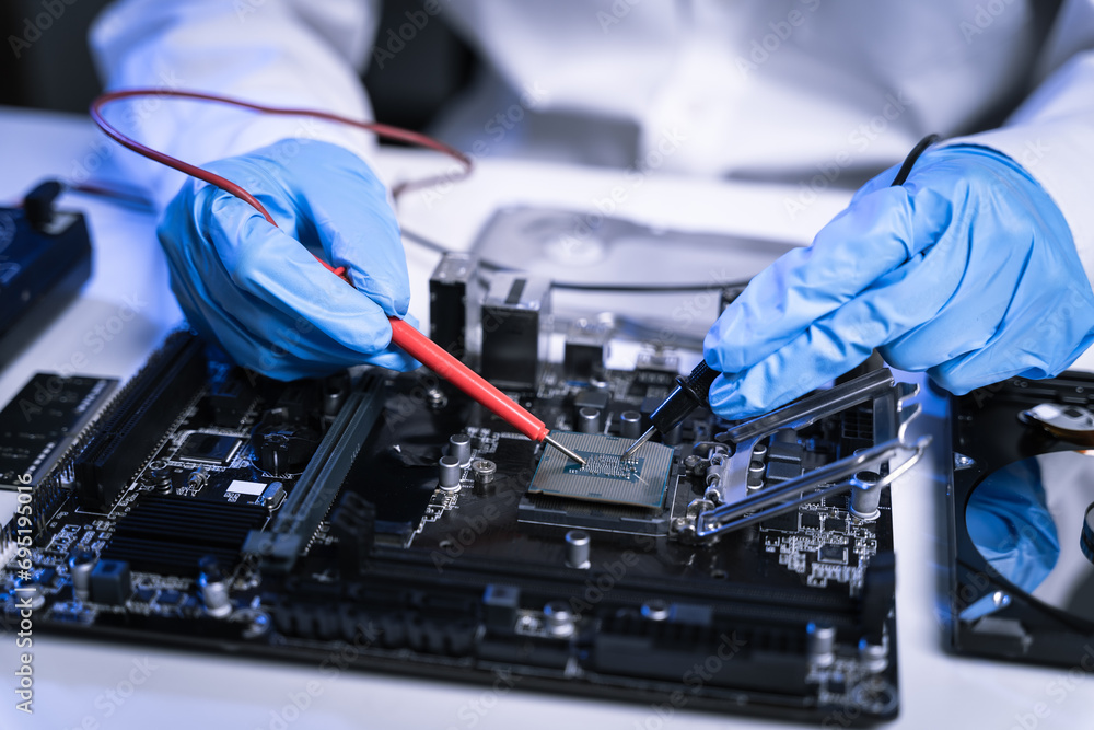 Naklejka premium Hands repairing electronic devices. Electronic technician.