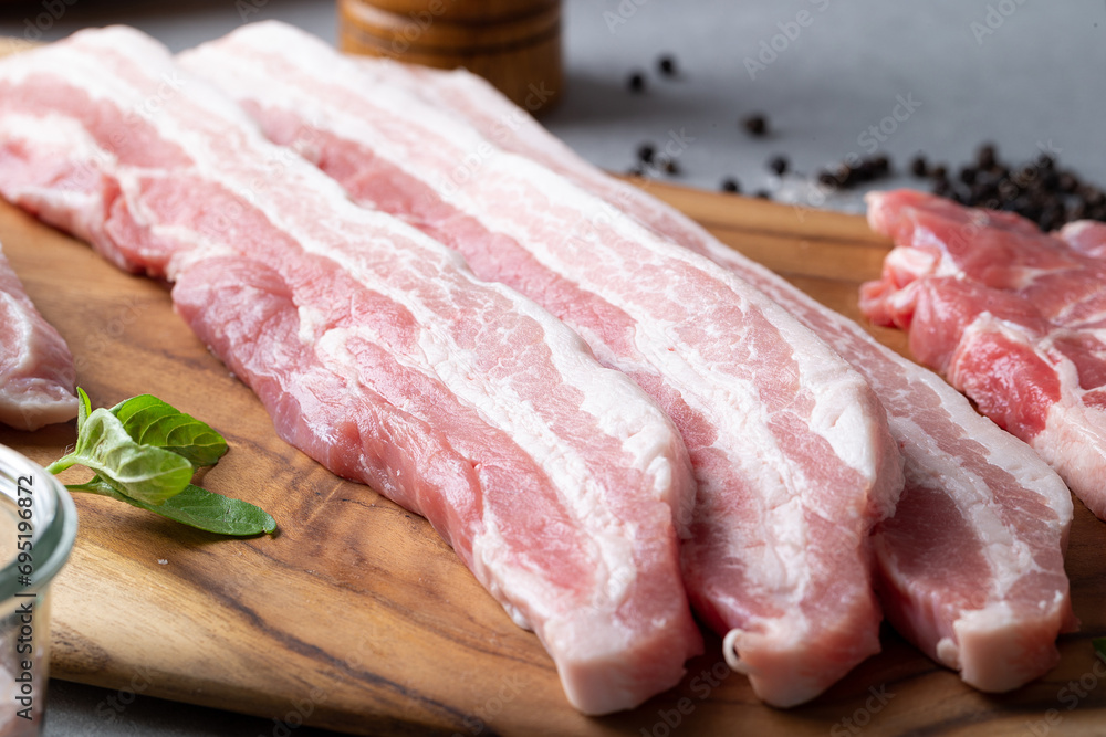 Fototapeta premium Fresh Samgyeopsal on wooden cutting board