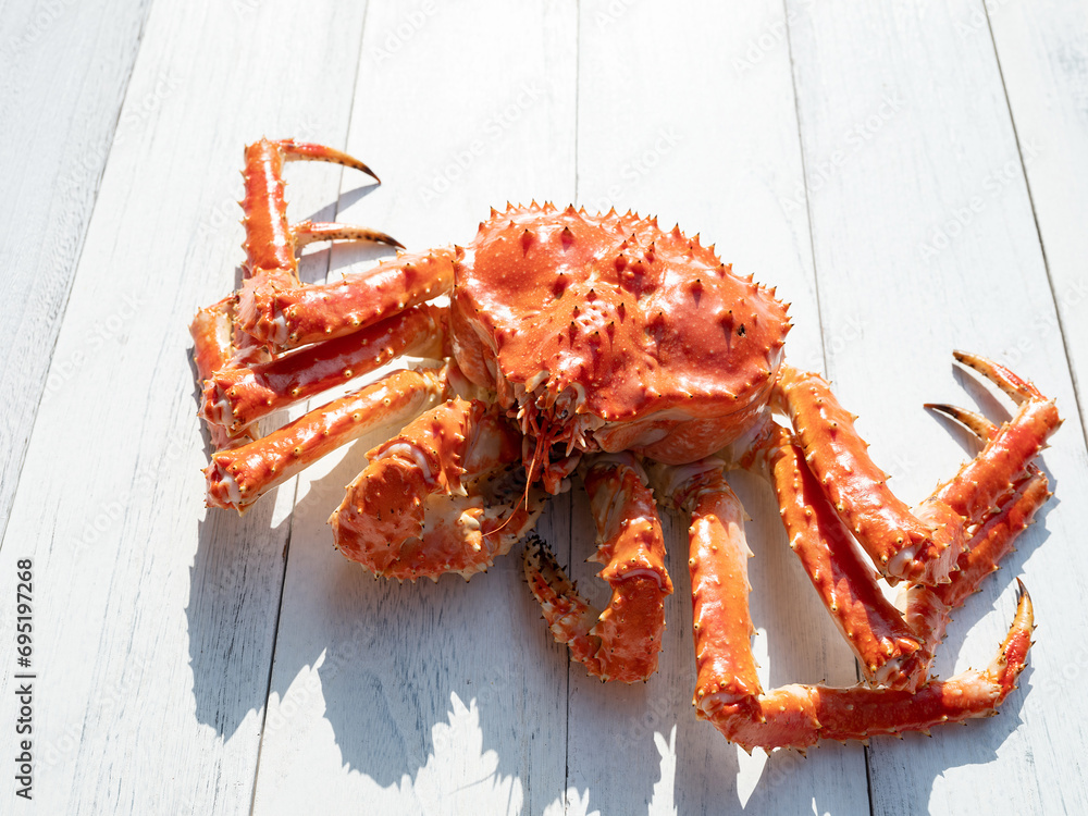 King crab on white wooden background