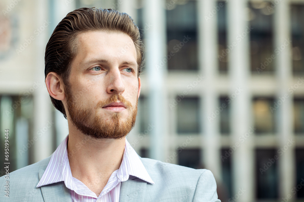 handsome businessman, summer day, outdoors near modern business centre handsome businessman, summer day, outdoors near modern business centre