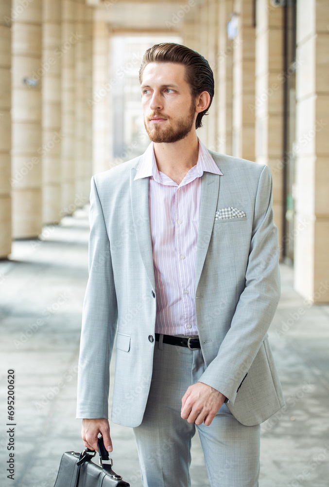 handsome businessman, summer day, outdoors near modern business centre handsome businessman, summer day, outdoors near modern business centre
