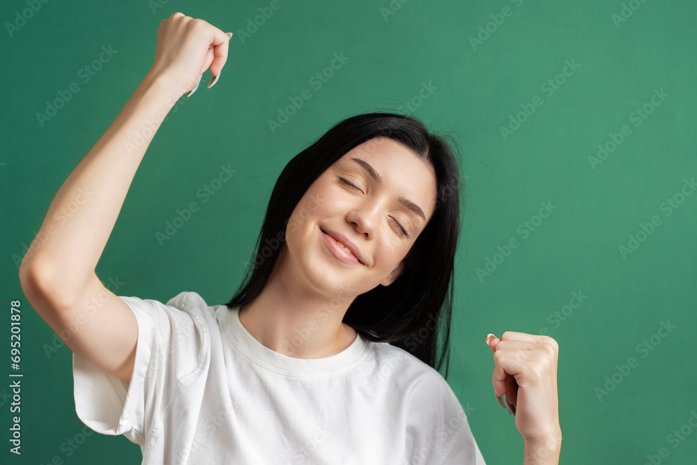 Portrait of a young girl who rejoices in success.