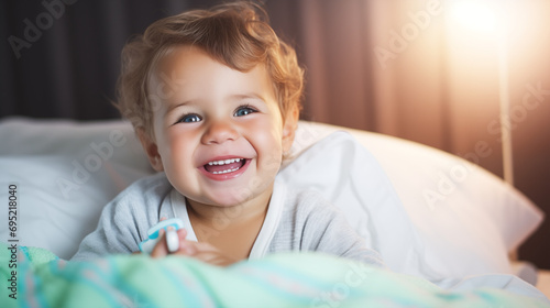 Wallpaper Mural Happy baby boy inside the bed, having a good morning. Torontodigital.ca