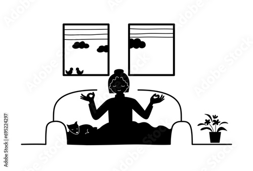 Silhouette of a happy introvert woman doing meditation on a couch at home with a dog.