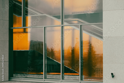 Abstract background of glass on the windows in a building in orange