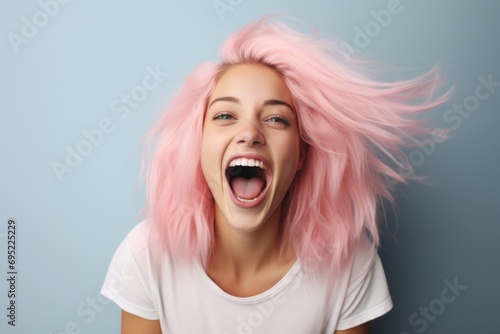 A woman with pink hair wearing a white t-shirt. Perfect for fashion and beauty themes