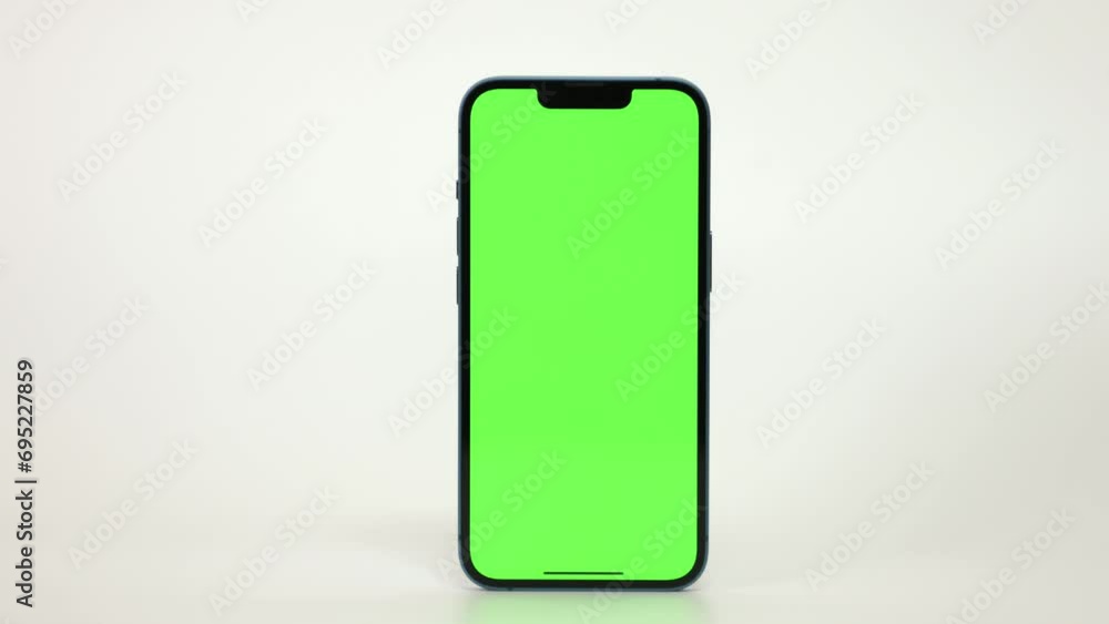 Close Up of Mobile Phone With Green Mock-up Screen On White Background Close Up of Mobile Phone With Green Mock-up Screen On White Background